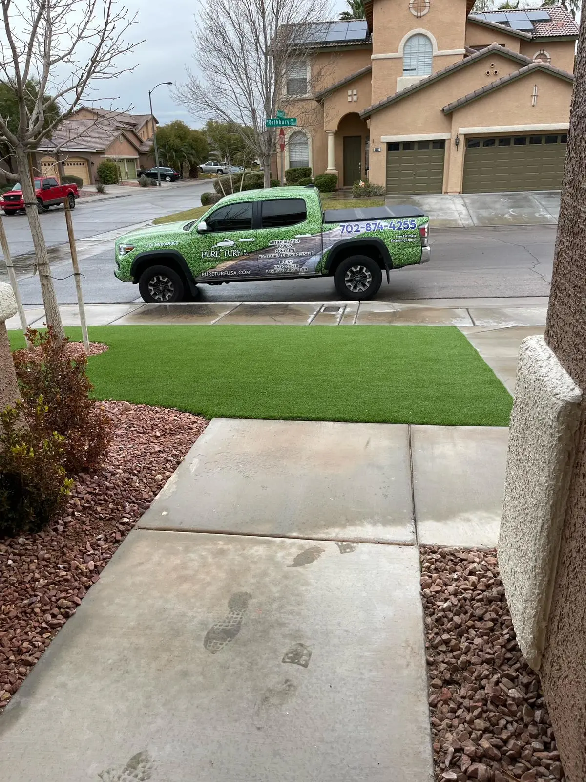 Pure Turf USA truck at a finished front yard
