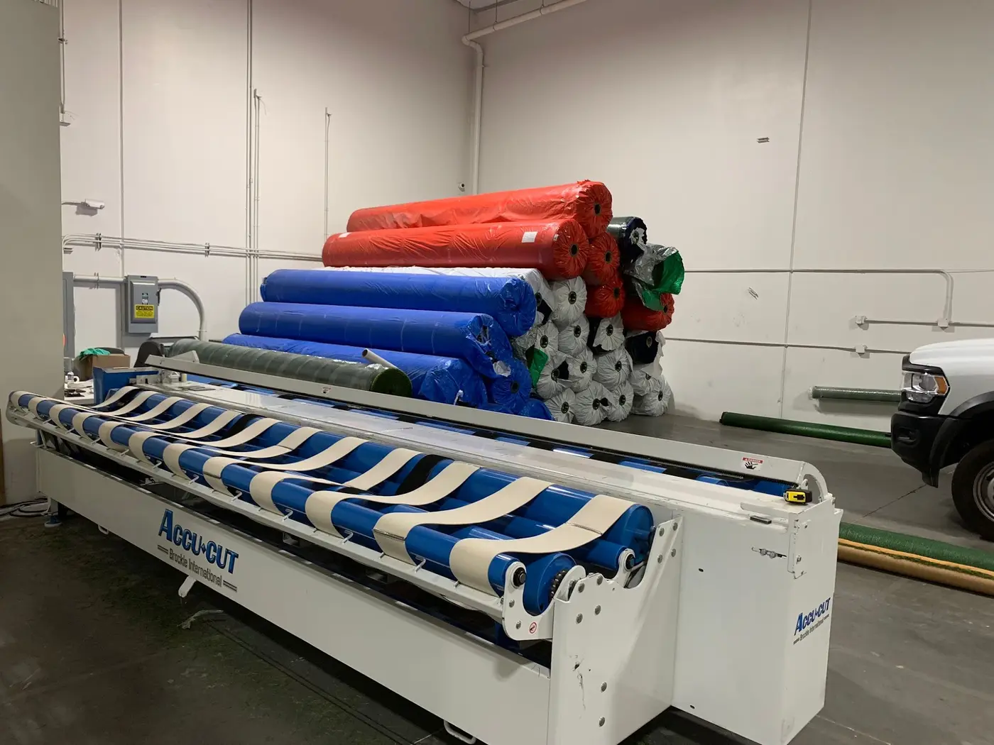 Rolls of artificial turf in production